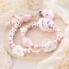 Coffret Hochet et attache tétine nuage rose
