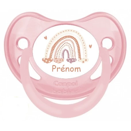 tetine-personnalisee-rose-arc-en-ciel Sucette personnalisée rose pâle avec motif arc-en-ciel et prénom