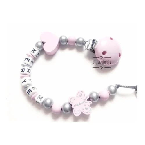 Attache tetine papillon coeur rose pale