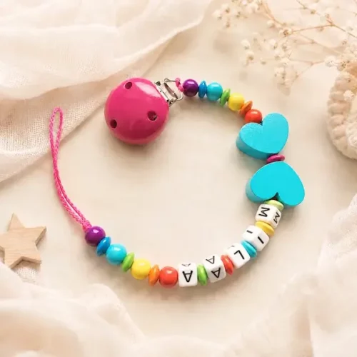attache tetine papillon turquoise clip bois Kids and crea